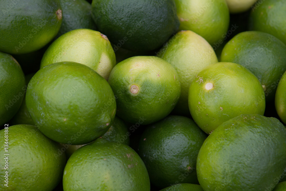 Many limes closeup different green shades Many limes closeup different green shades