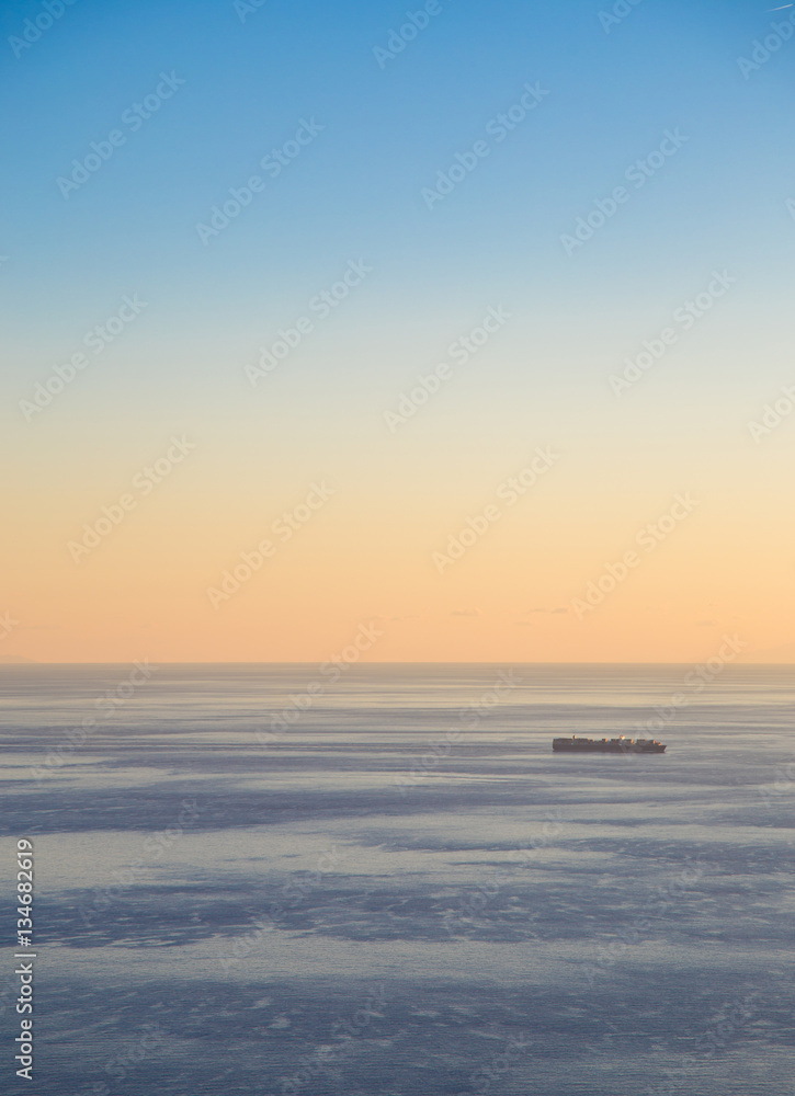Transport ship at sunset