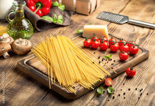 Italian spaghetti with set of ingredients for cooking pasta