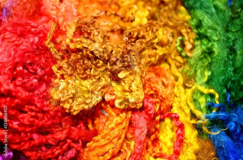 background with soft wool strands and curls of a thousand colors