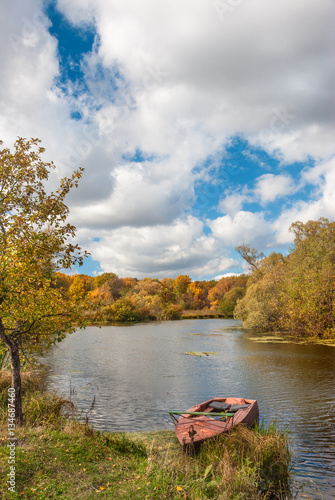 Autumn landscape with old boat