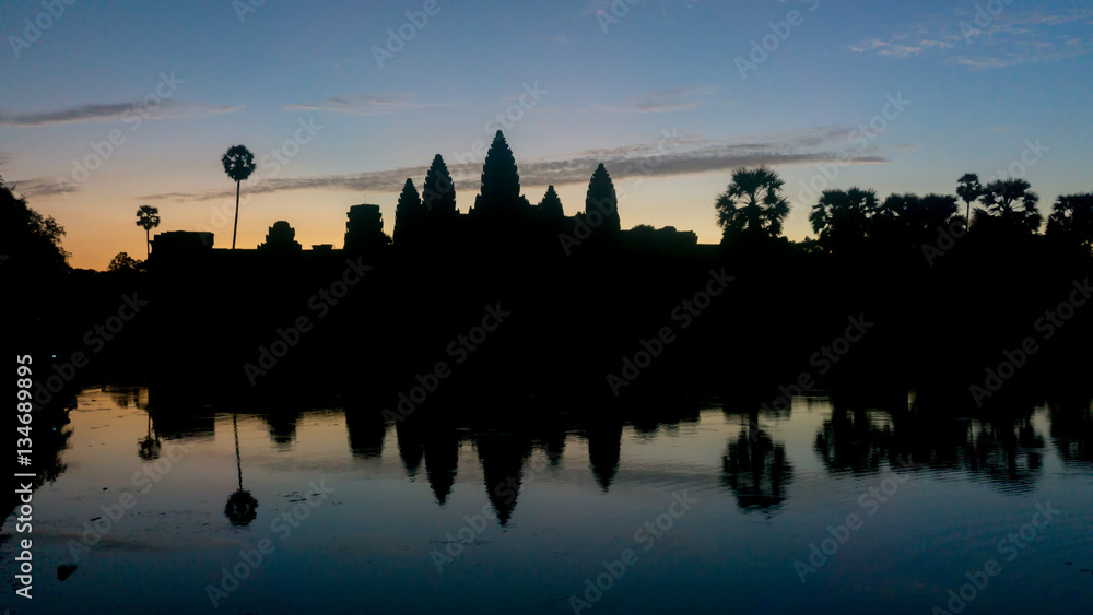 Obraz premium Siem Reap, Cambodia, December 06, 2015: Silhouette of Angkor Wat temple in Cambodia during sunrise. Angkor Wat is one of the famous tourist attraction in the world, located at Cambodia.