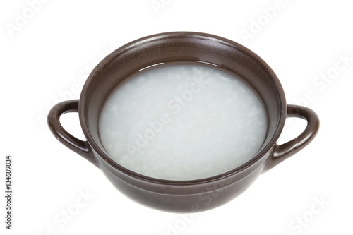 Bowl of Rice Porridge or Soft Boiled Rice with Wooden Chopsticks