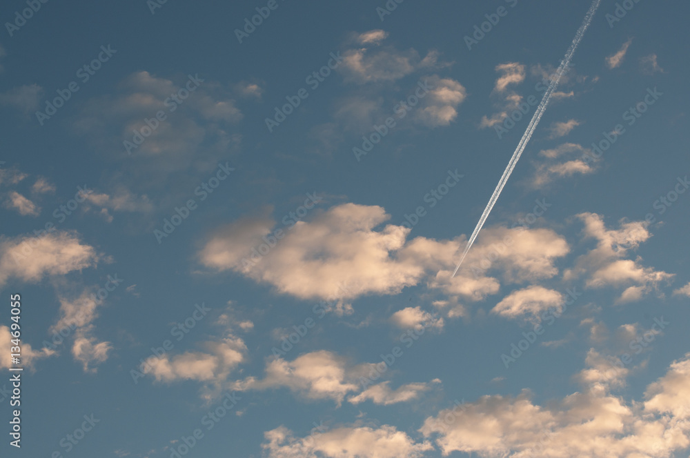 .Blue sky with clouds thin morning plane trip away. White smoke .Blue sky with clouds thin morning plane trip away. White smoke