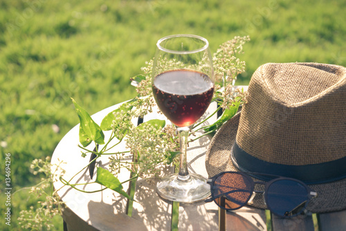 Glass of wine on the table  in park