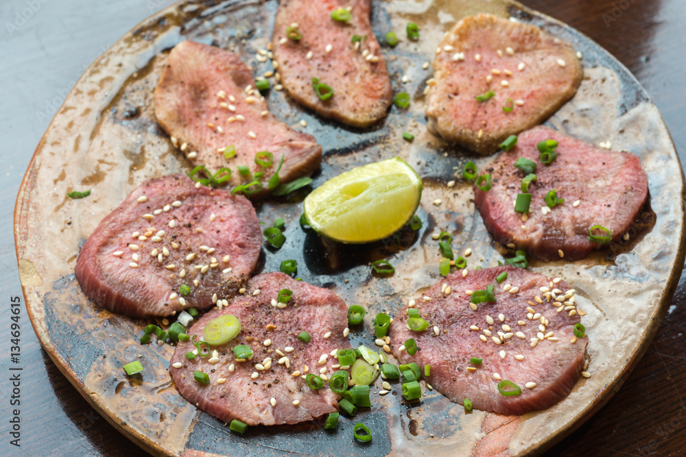 Barbecue sliced beef tongue marinated in pepper, onion, sesame oil and soy sauce. Barbecue sliced beef tongue marinated in pepper, onion, sesame oil and soy sauce.