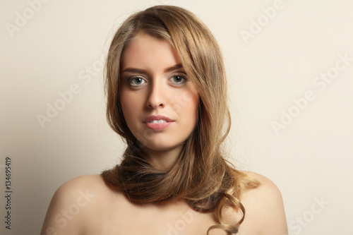 Portrait of charming girl with hair around her neck.
