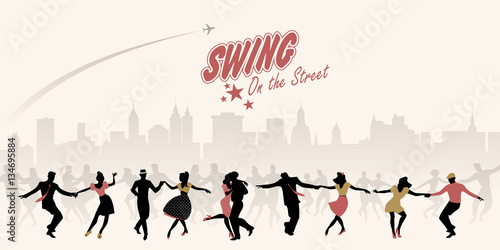 Group of young people dancing swing, lindy or rock n' roll on the street