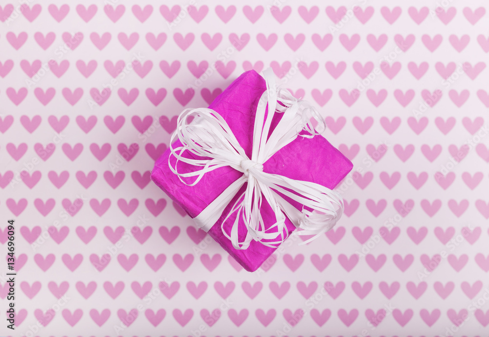 Background with gift boxes and hearts on white painted wooden planks. Place for text. Top view with copy space. Background with gift boxes and hearts on white painted wooden planks. Place for text. Top view with copy space.