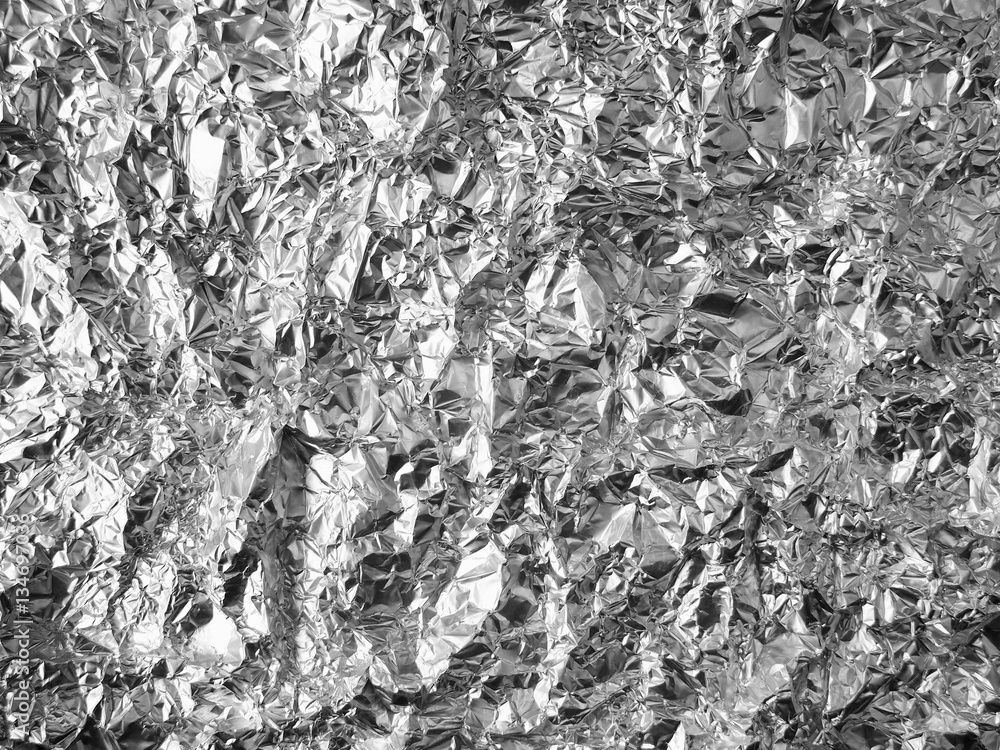 Silver crumpled foil texture background. Silver crumpled foil texture background.