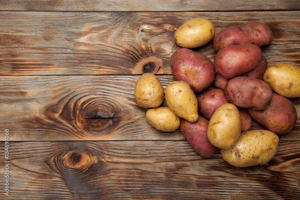 Potatoes on a rustic background Potatoes on a rustic background