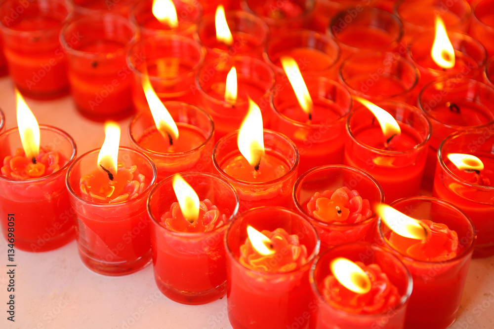 Red candles burning in glass Red candles burning in glass