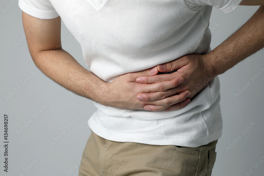 young man having a stomachache young man having a stomachache