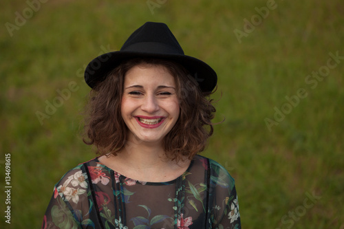 Beautiful girl with flowered dress an black hat © Gelpi