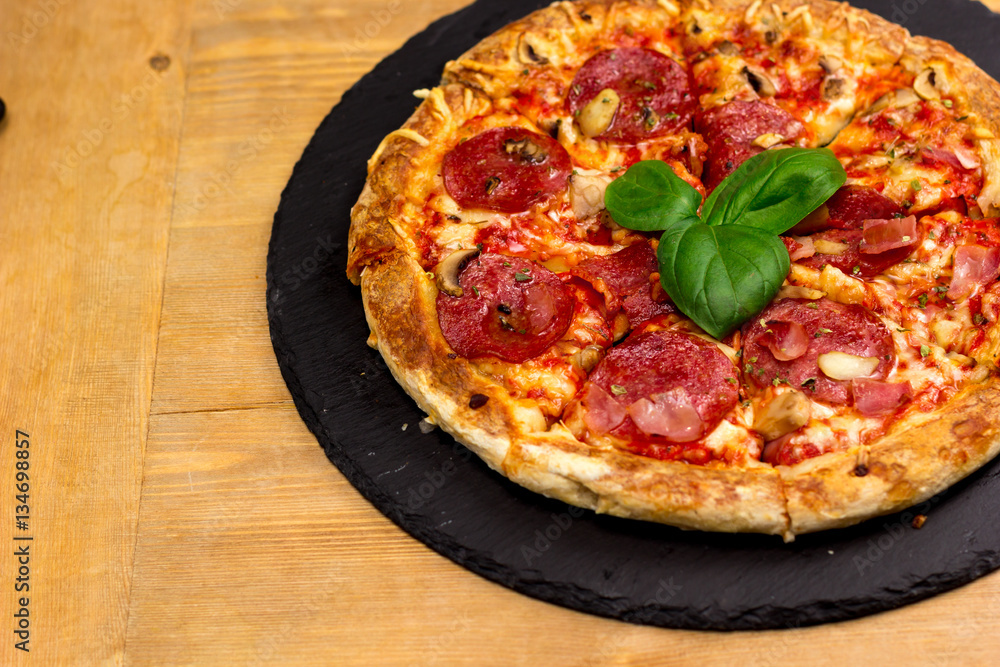 Delicious italian pizza served on wooden table