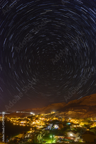 Star trails over the town of Metajna, Pag island, Croatia.