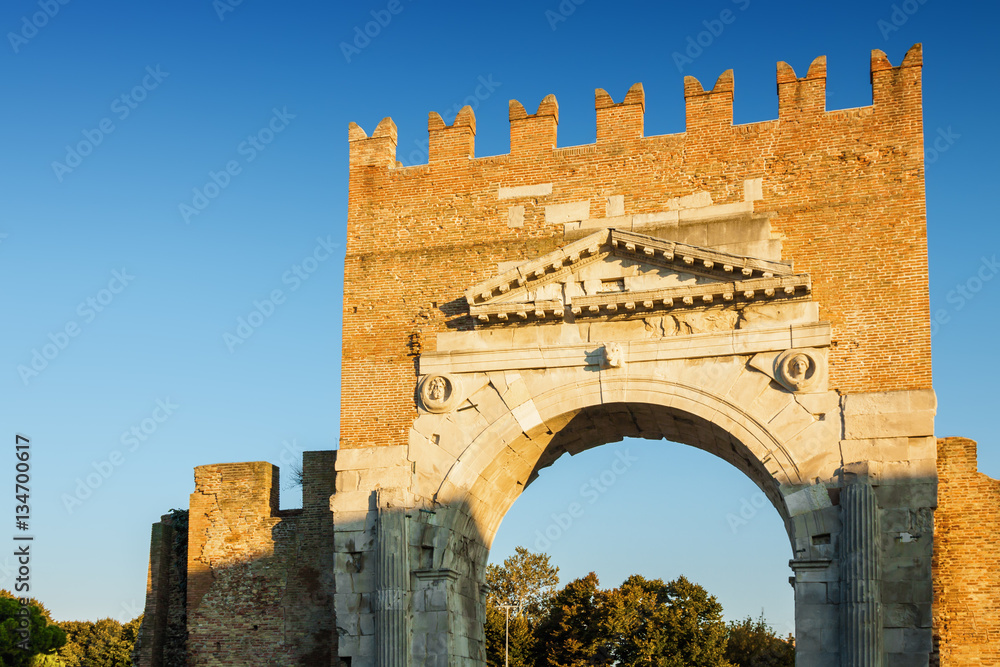 Arch of Augustus - ancient romanesque gate of the city, historical italian landmark, the most ancient roman arch that still stands intact, Rimini, Emilia-Romagna region, Italy.