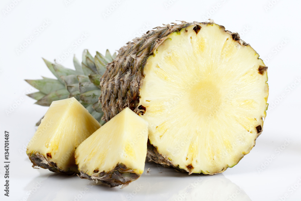 Pineapple with slices on white background Pineapple with slices on white background