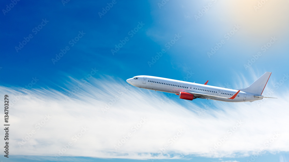 Airplane flying above clouds.