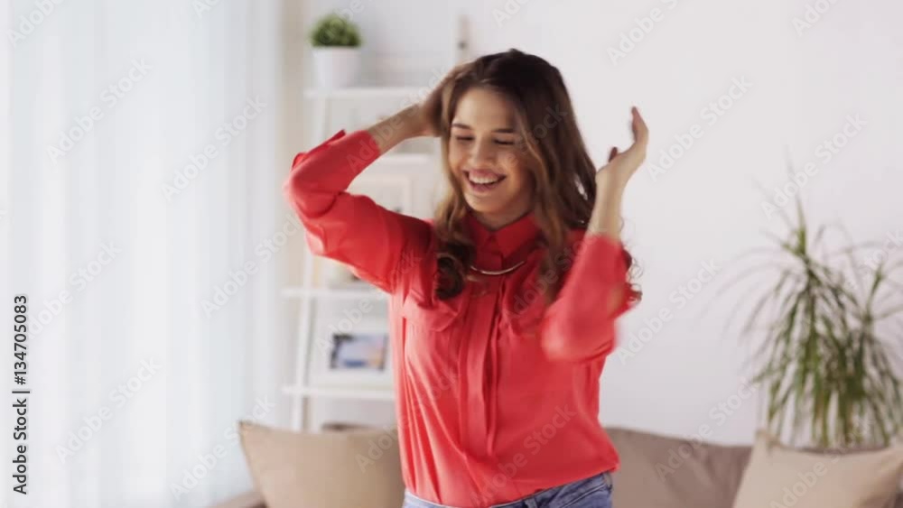 happy young woman dancing at home happy young woman dancing at home