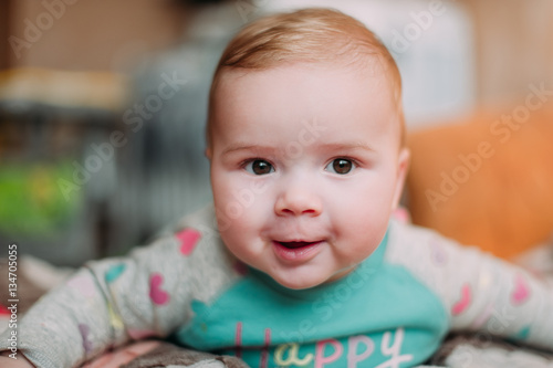 little cute baby toddler on carpet close up smiling adorable happy emotional playing at home