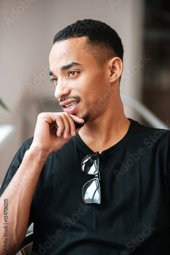 Portrait of a thoughtful young afro american man indoors