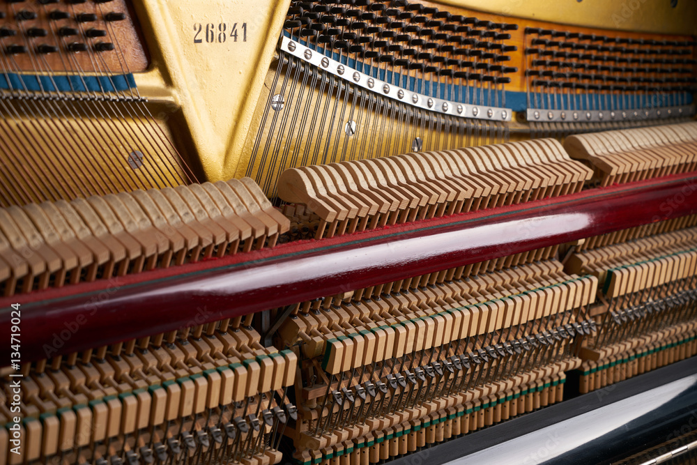 Close up of mechanics inside of an upright piano Close up of mechanics inside of an upright piano