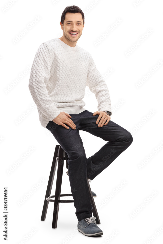 Happy guy sitting on a chair