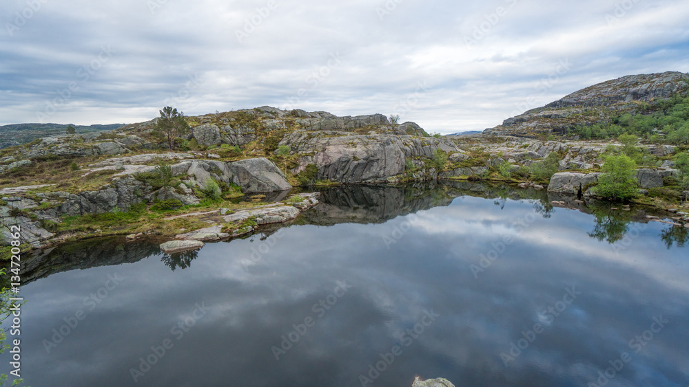 Obraz premium Forsand, Norway - May 28, 2016: Lake on the Preikestolen (Pulpit Rock) hike trail