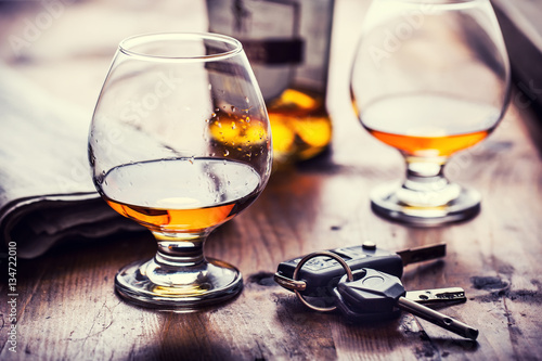 Alcoholism. Cup cognac or brandy hand man the keys to the car and irresponsible driver.