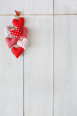 Valentine day background, pillow hearts bunch on wood, copy space