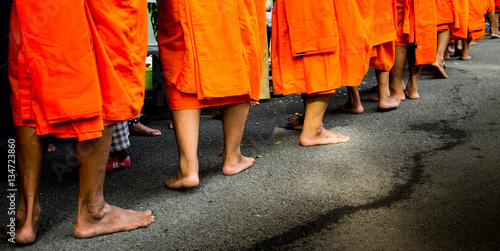 Buddhist monks are barefoot on road © KION