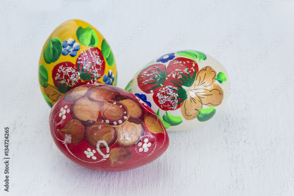 easter eggs/hand made painted eggs on white wooden background