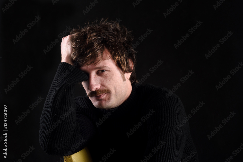 Portrait of an attractive man on black background