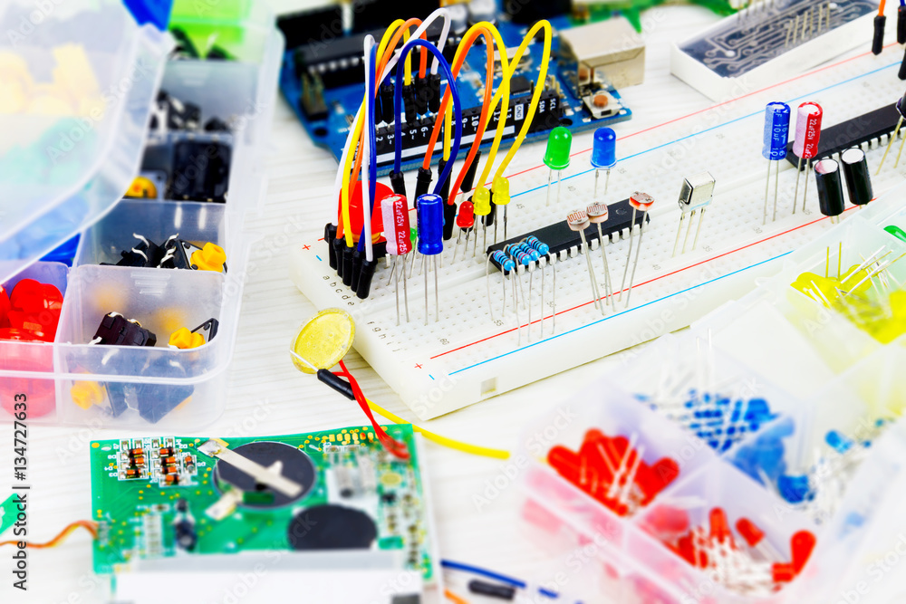 Prototype board with microcontrollers, chips, resistors and light