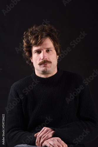 Portrait of an attractive man on black background