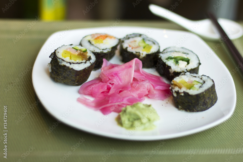 Set of rolls on a white plate. Sushi. Wasabi. Ginger.
Set of rolls on a white plate. Sushi. Wasabi. Ginger.