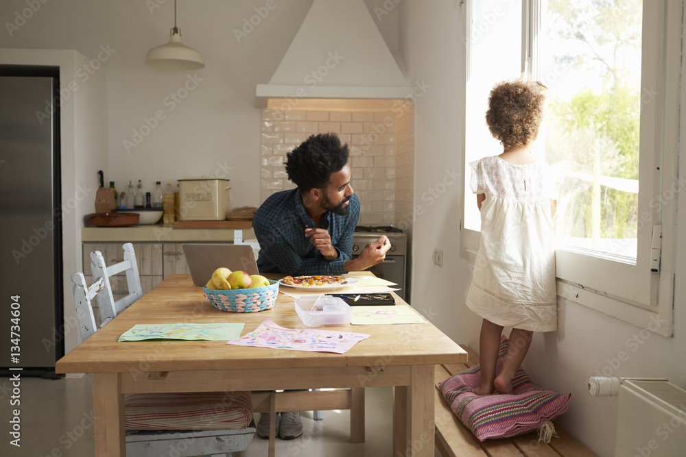 Father And Daughter Paint And Eat Pizza At Kitchen Table Father And Daughter Paint And Eat Pizza At Kitchen Table