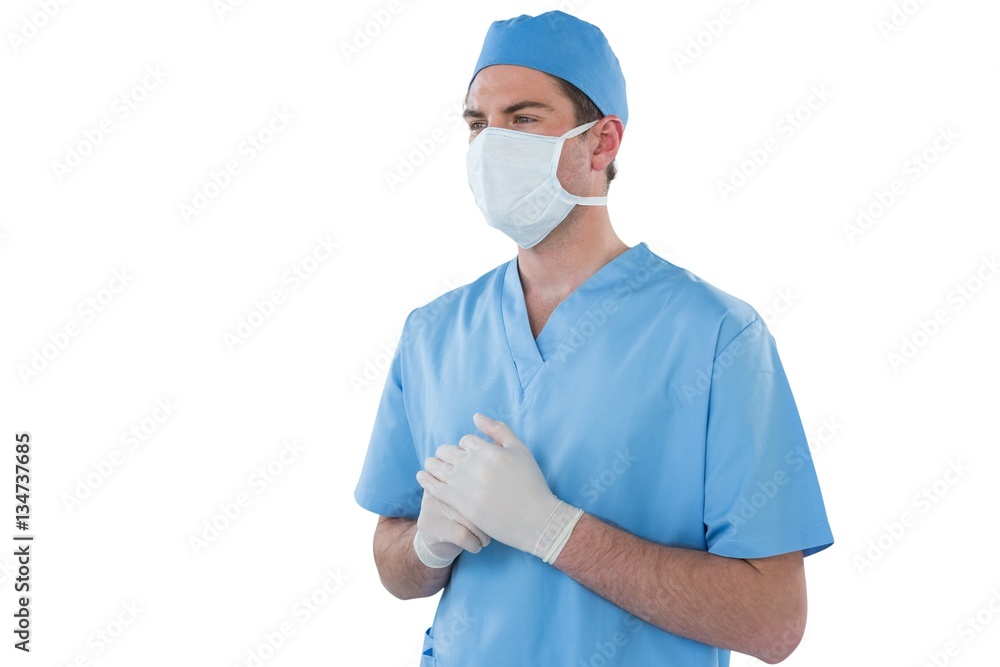 Surgeons hand wearing surgical gloves and holding Surgeons hand wearing surgical gloves and holding