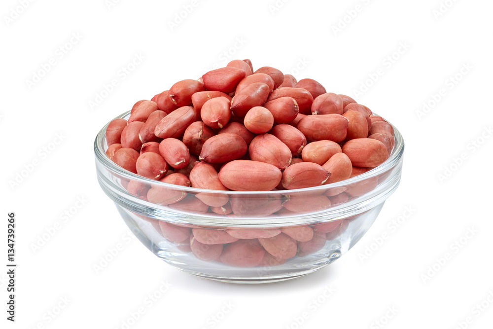 Peanuts in glass bowl on white Peanuts in glass bowl on white