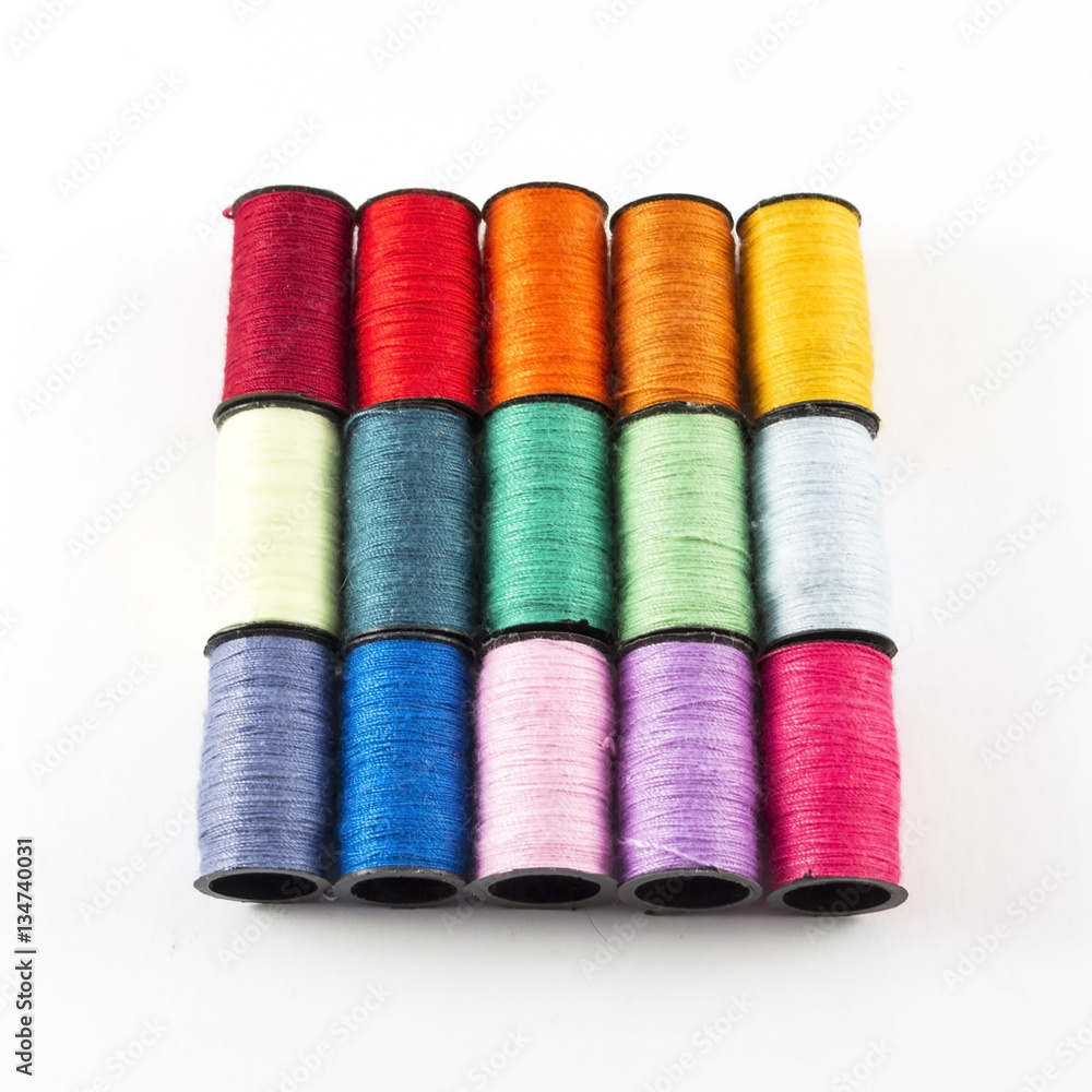 Sewing threads on white background Sewing threads on white background