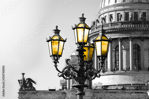 St. Petersburg. Black and white view of Saint Isaac Cathedral in Saint Petersburg with color vintage street lamp with yellow light