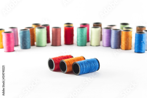 Sewing threads on white background