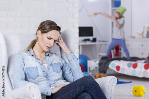 Tired mother of hyperactive child