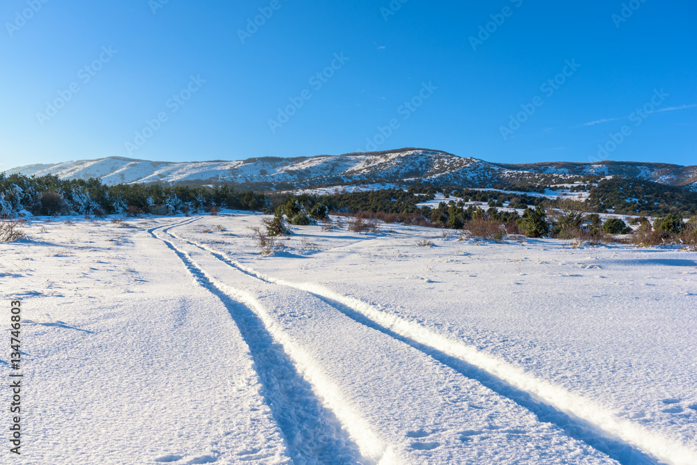 Snowy road leads to the mountain Agarmysh. Russia, Stary Krym.