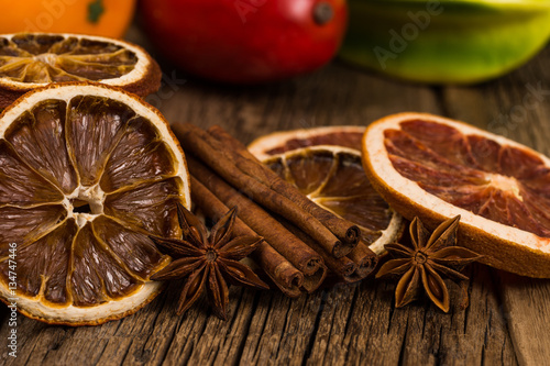 Dried oranges and grapefruits on an old wooden table.