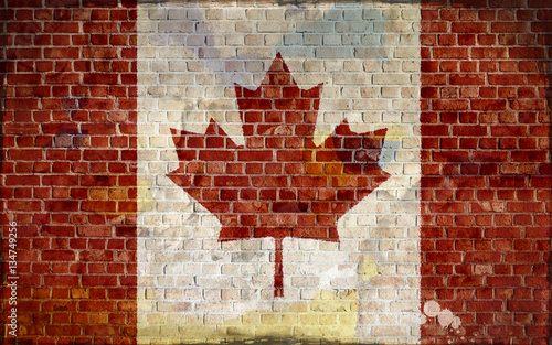 Canadian flag painted on a brick wall