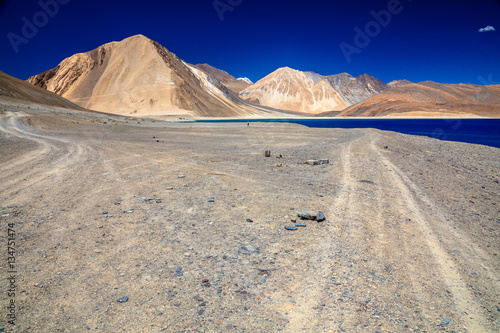 a beautiful mountain range naer pangong lake and a clearly sky