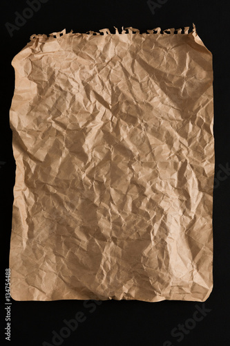 old paper sheet isolated on black background
