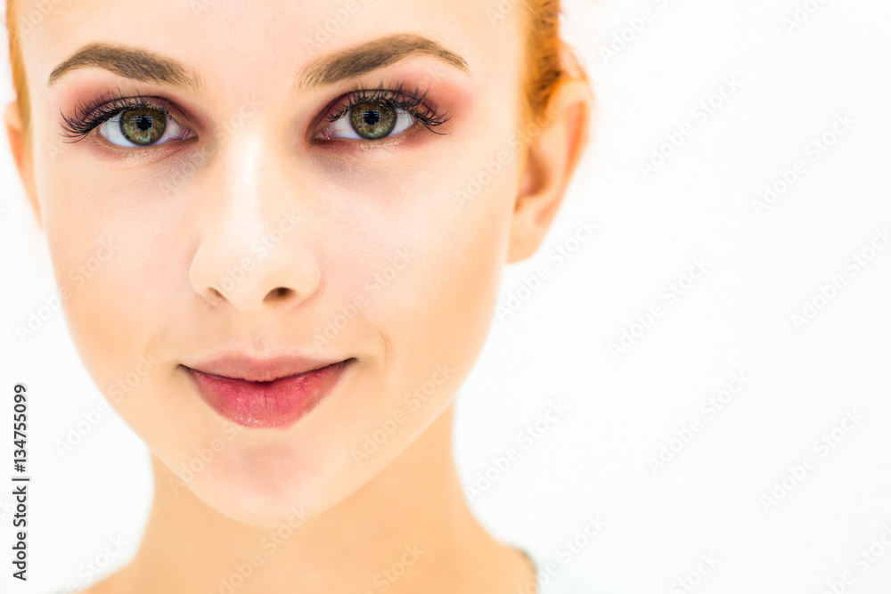 Woman with natural make-up eyes and lips on a light background. Close-up Woman with natural make-up eyes and lips on a light background. Close-up